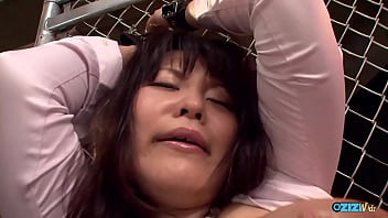 Asian woman with large breasts is restrained and used as a sexual object