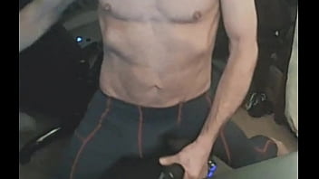 Stretching in spandex on stool with massage gun