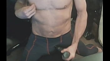 Stretching in spandex on stool with massage gun