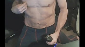 Stretching in spandex on stool with massage gun