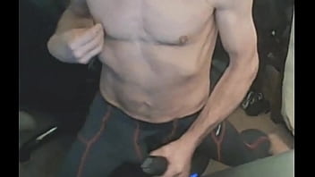 Stretching in spandex on stool with massage gun