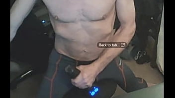 Stretching in spandex on stool with massage gun