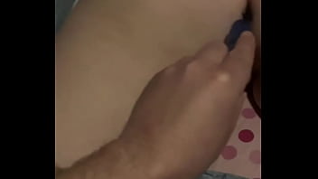 Tattooed girlfriend plays with toy