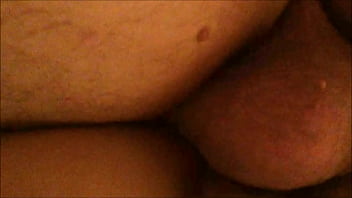 From behind and below