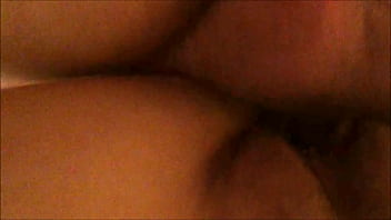 From behind and below