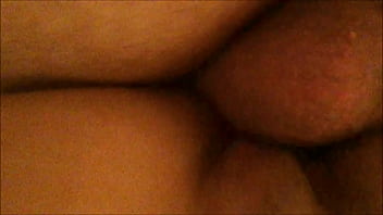 From behind and below