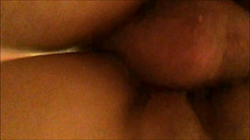 From behind and below