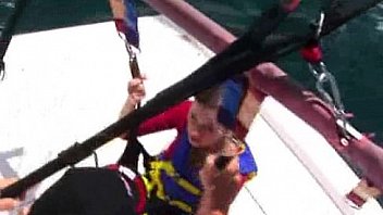 Bikinied teens parasailing