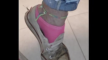 Trashed sneakers and jeans