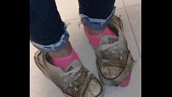 Trashed sneakers and jeans