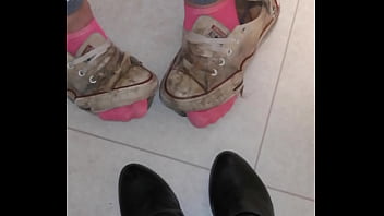 Trashed sneakers and jeans