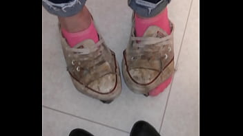 Trashed sneakers and jeans