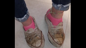 Trashed sneakers and jeans