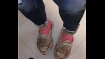 Trashed sneakers and jeans