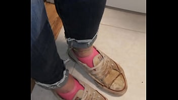 Trashed sneakers and jeans