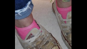 Trashed sneakers and jeans