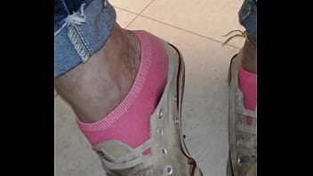 Trashed sneakers and jeans