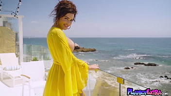 Glamorous huge titted naked cougar posing at her balcony