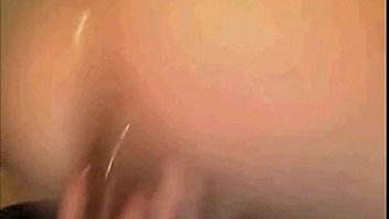 Brunette putting a dildo in the ass