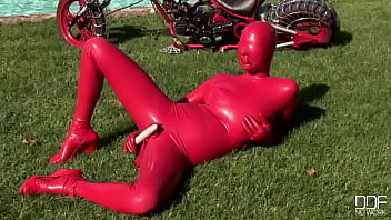 Busty babe toying in full latexwear