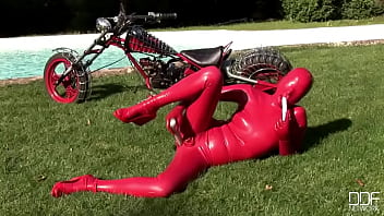 Busty babe toying in full latexwear