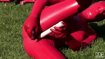 Busty babe toying in full latexwear