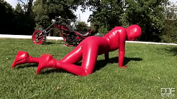 Busty babe toying in full latexwear