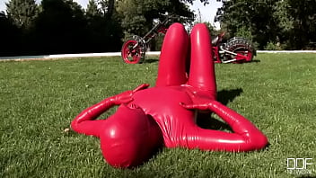 Busty babe toying in full latexwear