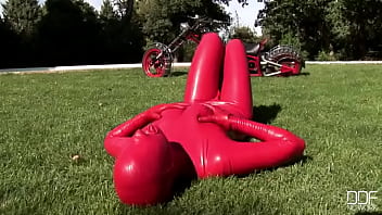 Busty babe toying in full latexwear