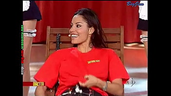 Cute lady in a miniskirt shows pantyhose upskirts on live television