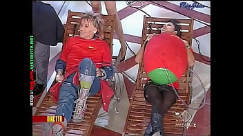 Cute lady in a miniskirt shows pantyhose upskirts on live television