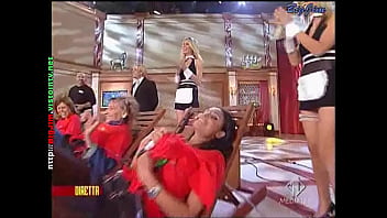 Cute lady in a miniskirt shows pantyhose upskirts on live television