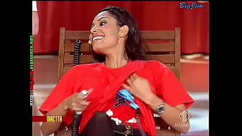 Cute lady in a miniskirt shows pantyhose upskirts on live television