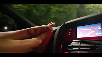 Girl shows pretty feet while driving with bbc
