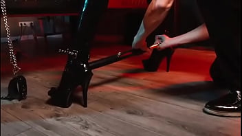 Spread your legs pleaser heels with rubber toe socks and a full black catsuit caught in a spreader bar ready to be used