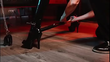 Spread your legs pleaser heels with rubber toe socks and a full black catsuit caught in a spreader bar ready to be used