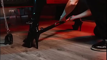 Spread your legs pleaser heels with rubber toe socks and a full black catsuit caught in a spreader bar ready to be used