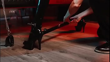 Spread your legs pleaser heels with rubber toe socks and a full black catsuit caught in a spreader bar ready to be used