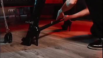 Spread your legs pleaser heels with rubber toe socks and a full black catsuit caught in a spreader bar ready to be used