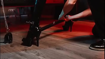 Spread your legs pleaser heels with rubber toe socks and a full black catsuit caught in a spreader bar ready to be used