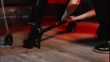 Spread your legs pleaser heels with rubber toe socks and a full black catsuit caught in a spreader bar ready to be used
