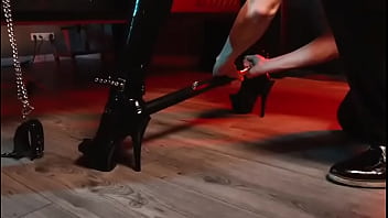 Spread your legs pleaser heels with rubber toe socks and a full black catsuit caught in a spreader bar ready to be used