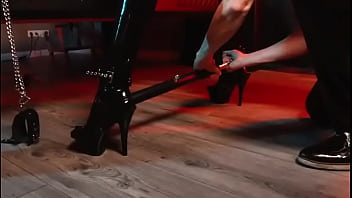 Spread your legs pleaser heels with rubber toe socks and a full black catsuit caught in a spreader bar ready to be used