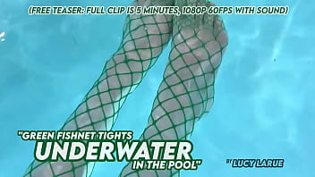 Green fishnet tights underwater in the pool