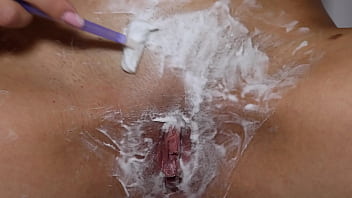 Beautiful blonde with natural tits shaves pussy pov