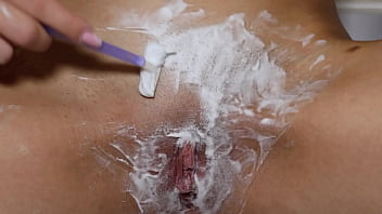 Beautiful blonde with natural tits shaves pussy pov