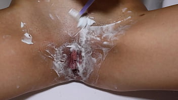 Beautiful blonde with natural tits shaves pussy pov