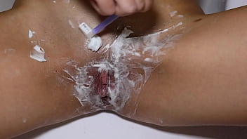 Beautiful blonde with natural tits shaves pussy pov