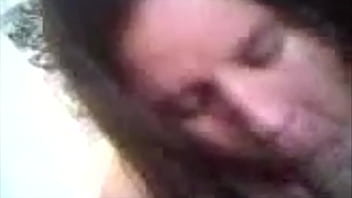 Chubby brunette blowing cock