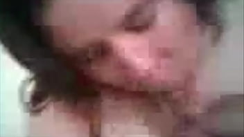 Chubby brunette blowing cock